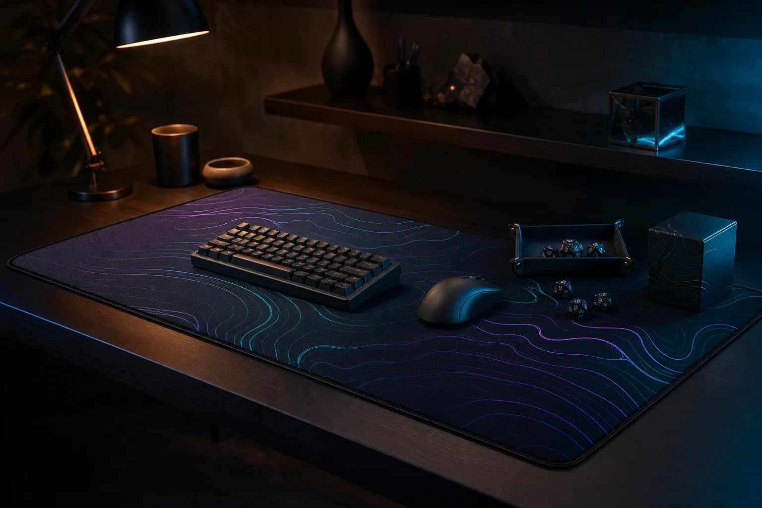 Dark gaming desk with a full-coverage desk mat, keyboard, mouse and tabletop accessories